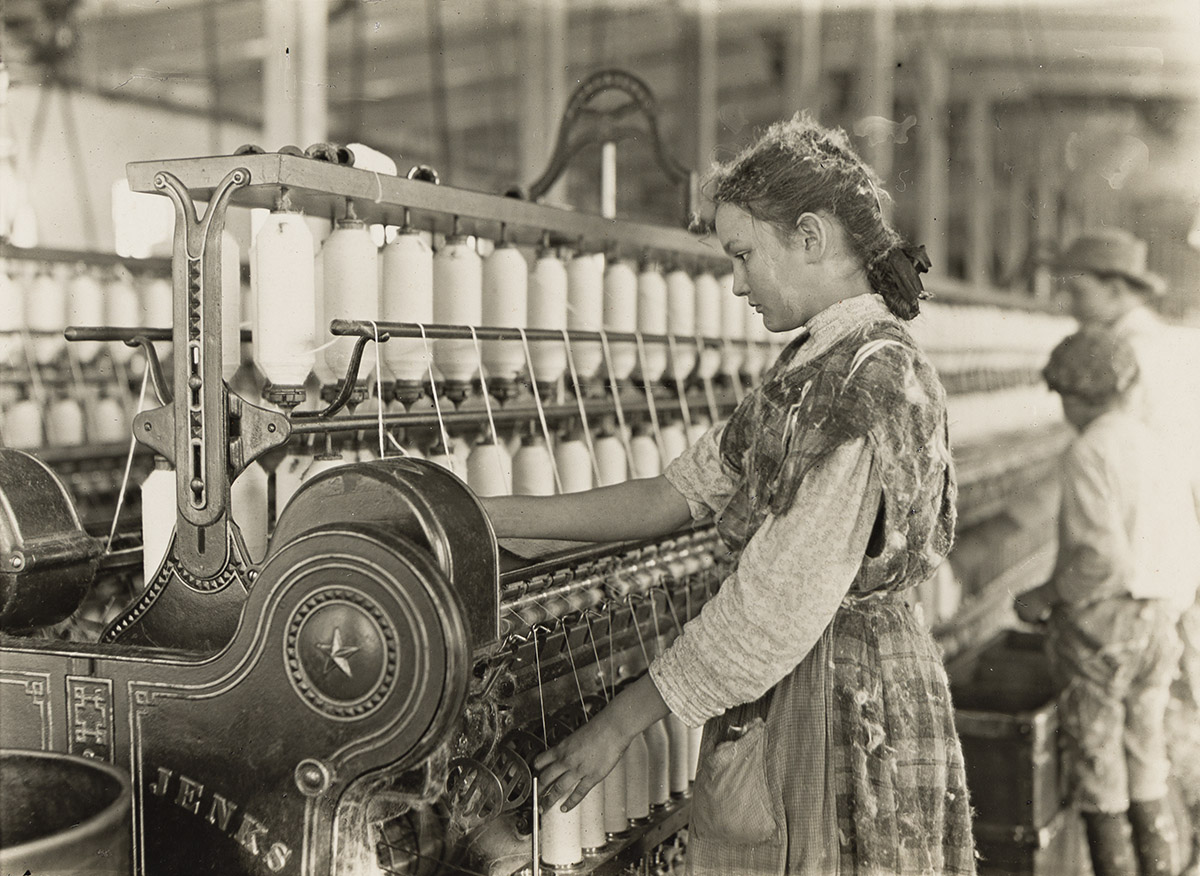 LEWIS W. HINE (1874-1940) Adolescent spinner, Carolina cotton mill.